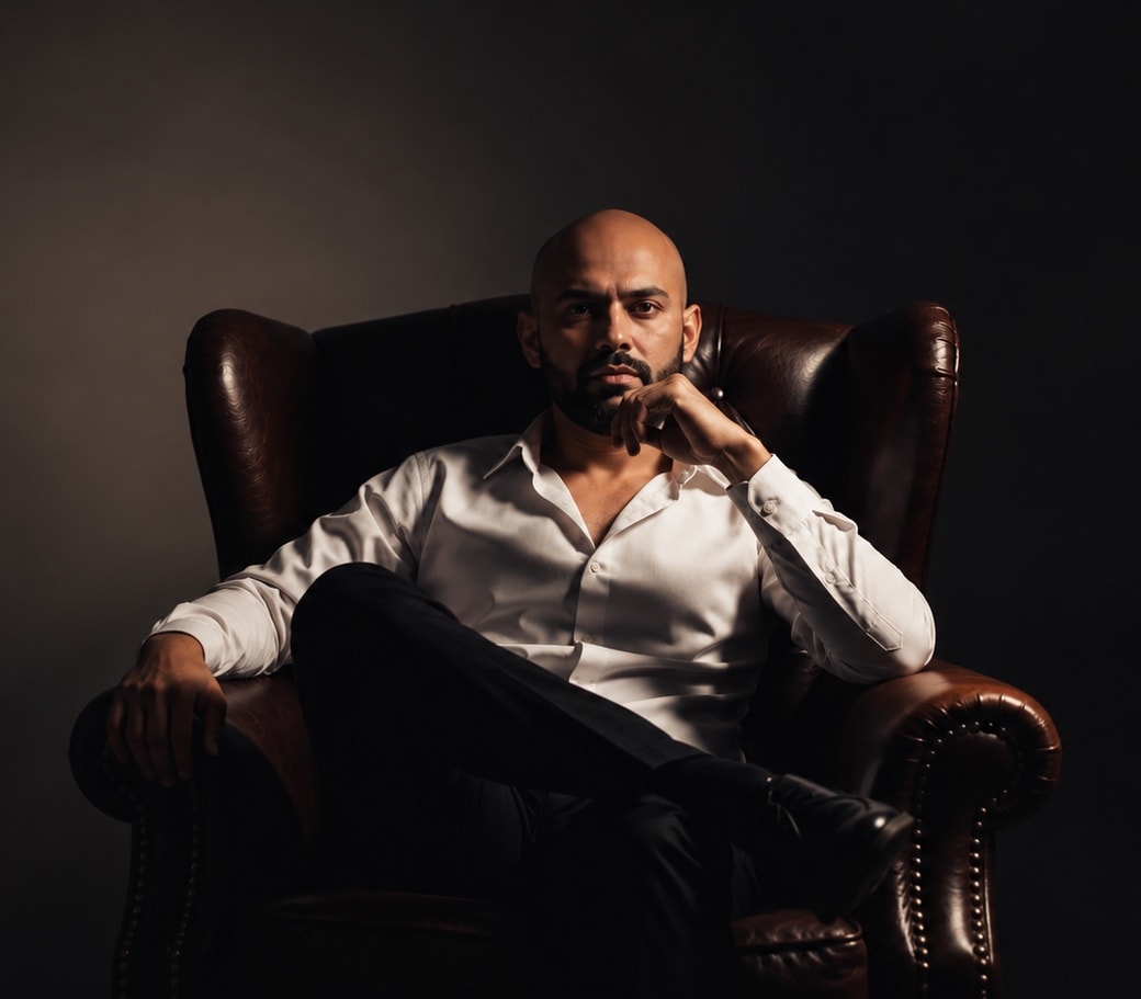 Radhin, founder of Radz VIP Signals, seated in a leather armchair